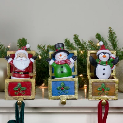 Northlight Santa Snowman And Penguin In Gift Boxes Christmas Stocking Holders - Set Of 3 - 6" 3 Northlight Santa Snowman And Penguin In Gift Boxes Christmas Stocking Holders - Set Of 3 - 6"