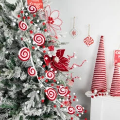 Northlight 30" Candy Cane Swirls And Pom Poms Christmas Garland -Festival northlight df94827 styled 28794.1693409622